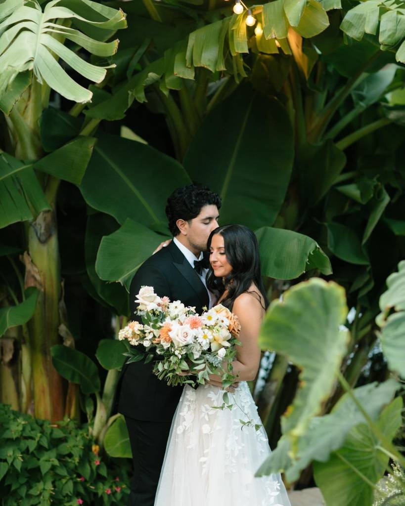 Juliana + Bobby had a dreamy outdoor October wedding. Their green color palette was complimented with pops of orange, and