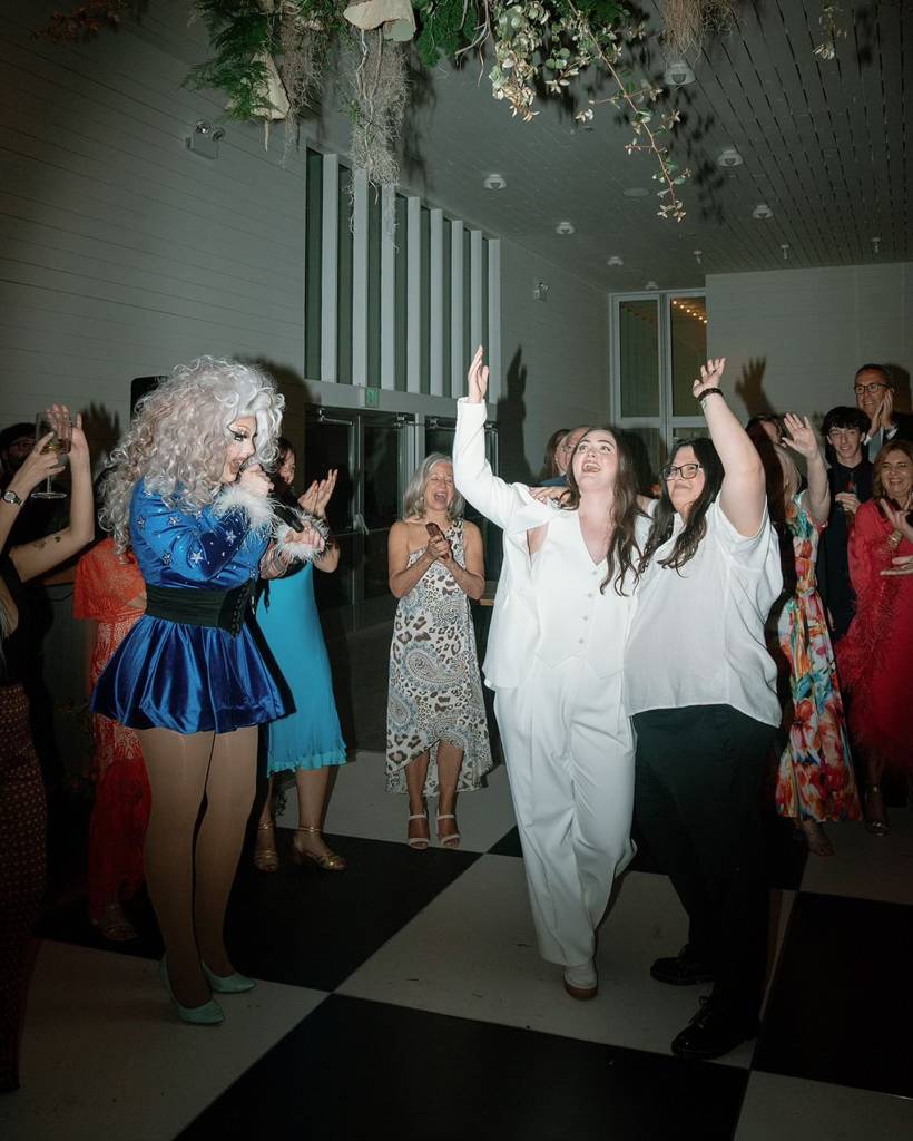 A drag queen got the party started at Sydney & Gaby’s wedding reception and it looked like a grand ol’