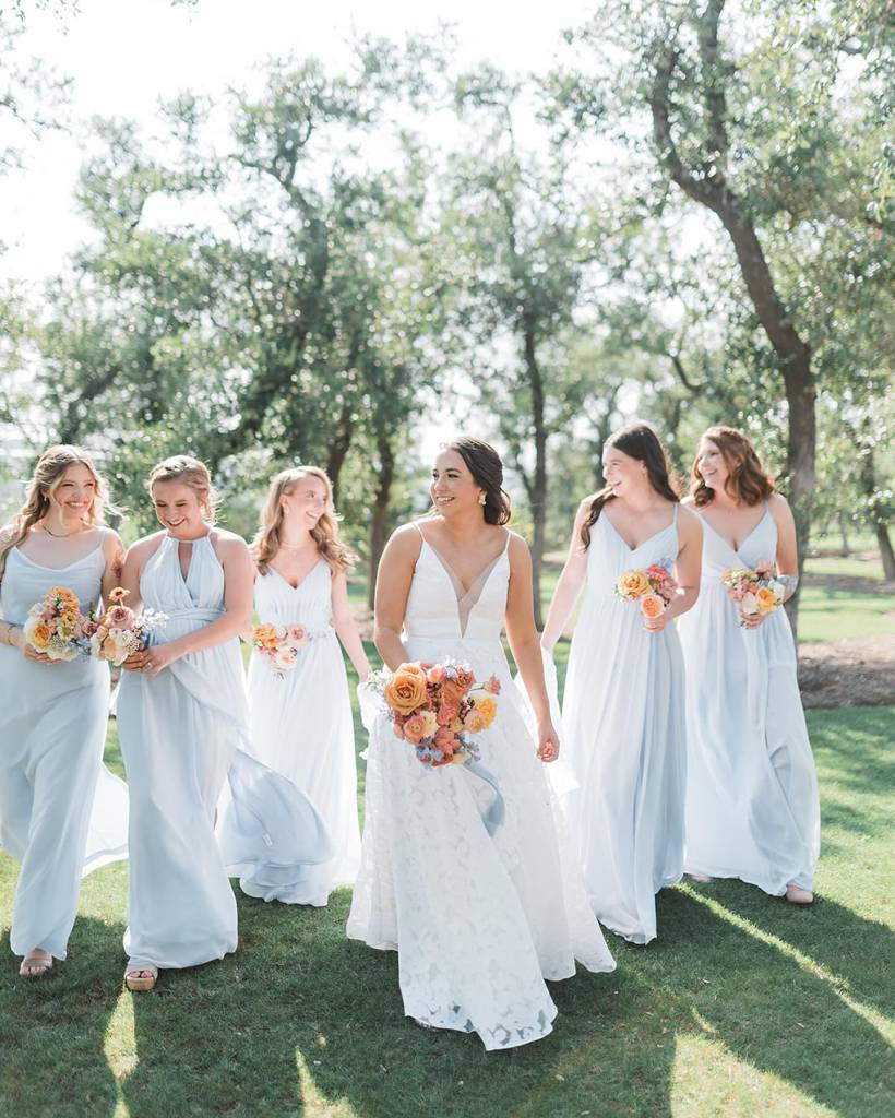 Kennedy & Austin had “something blue” scattered throughout their day. From the blue bridesmaid dresses, to the blue ribbon on